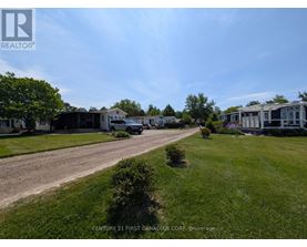 A brokerage company is advertising their services in a residential area.