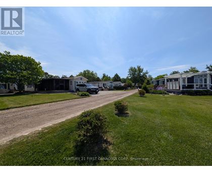 A brokerage company is advertising their services in a residential area.