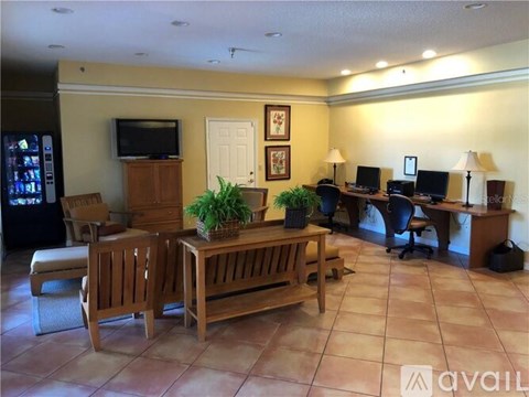 A living room with a wooden table and chairs.