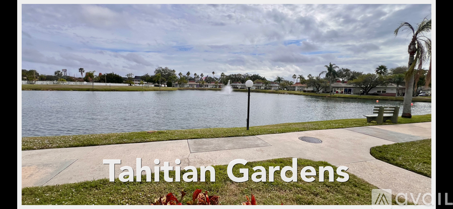 A park with a body of water and the words "Tahitian Gardens" written on it.