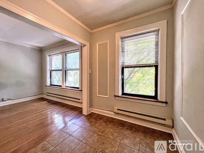A room with a window and a door.