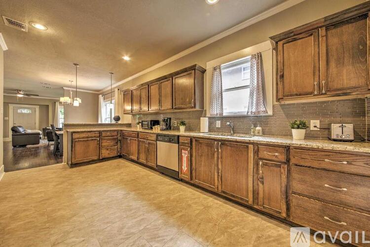 A kitchen with wooden cabinets and a countertop.