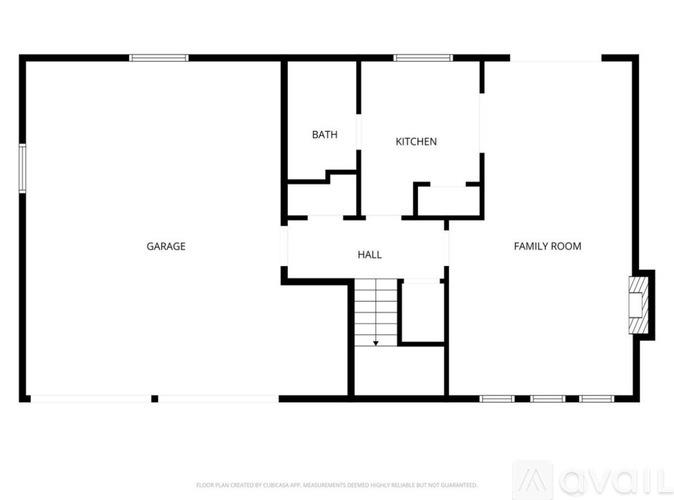 A floor plan of a house with a garage, kitchen, bath, family room, and hall.