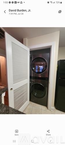 A modern kitchen with a built-in oven and microwave.