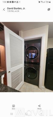 A modern kitchen with a built-in oven and microwave.