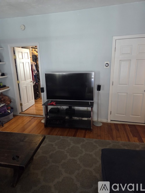 A living room with a television and a coffee table.