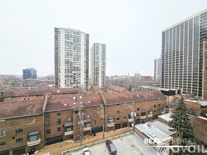 A view of a cityscape with a mix of modern and older buildings.
