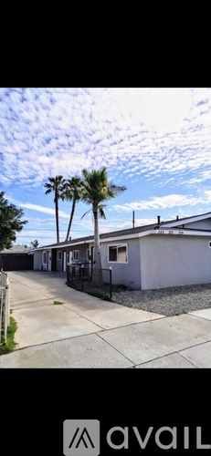 A row of houses with a clear sky above them.
