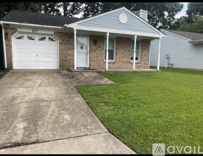 A house with a driveway in front of it.
