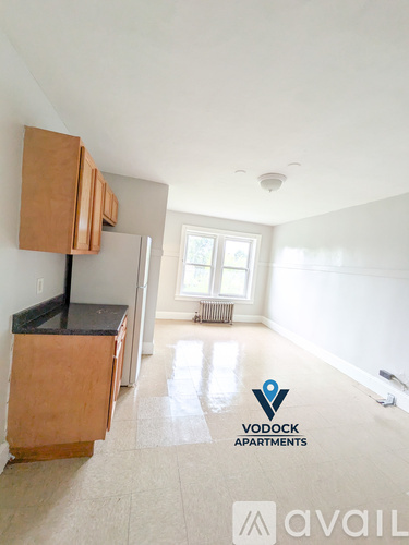 A spacious apartment with Vodock Apartments logo on the floor.