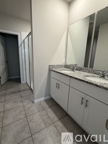 A bathroom with a sink and mirror.