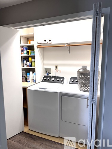 A small kitchen with a white fridge and a white oven.