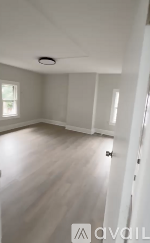 A room with a door and a window.