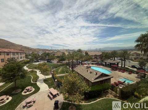A view of a pool and a house from a high angle.