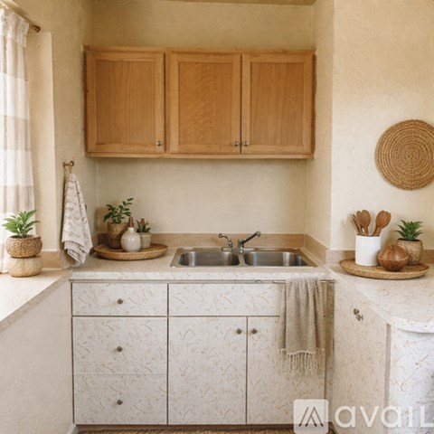 A kitchen with wooden cabinets and a white countertop.