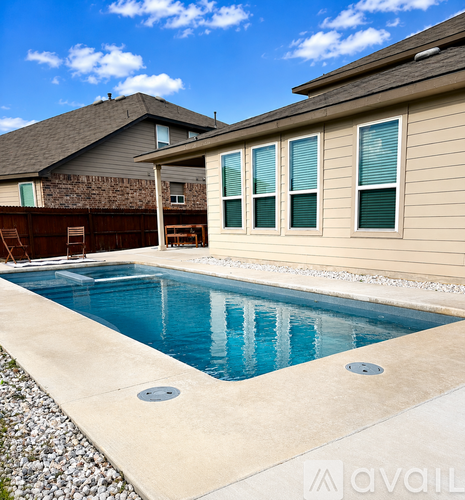 A house with a pool in the backyard.