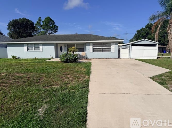 A house with a white garage door is for sale.