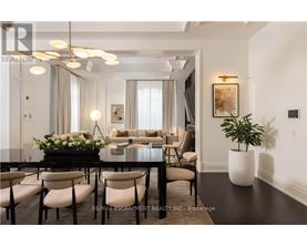 A well-lit, modern dining room with a table set for six.