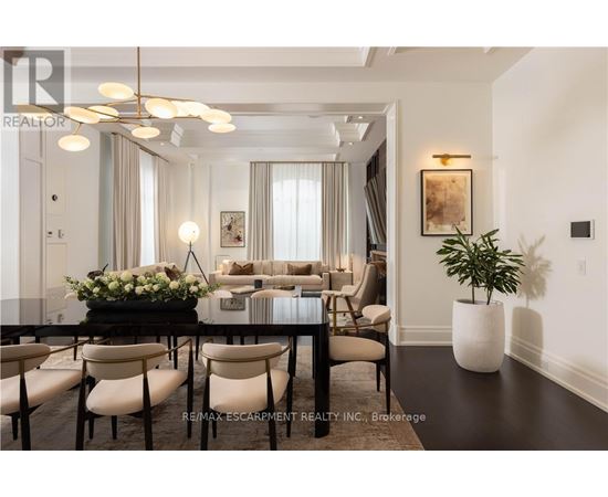 A well-lit, modern dining room with a table set for six.