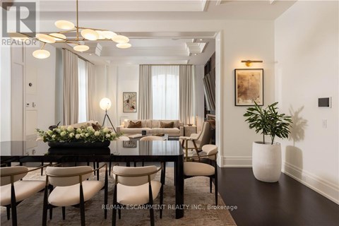 A well-lit, modern dining room with a table set for six.