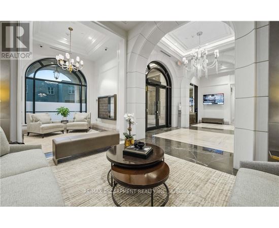 A living room with a large coffee table in the center.