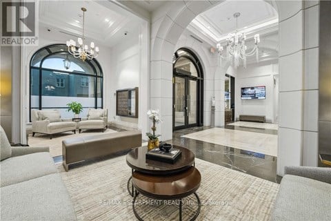 A living room with a large coffee table in the center.