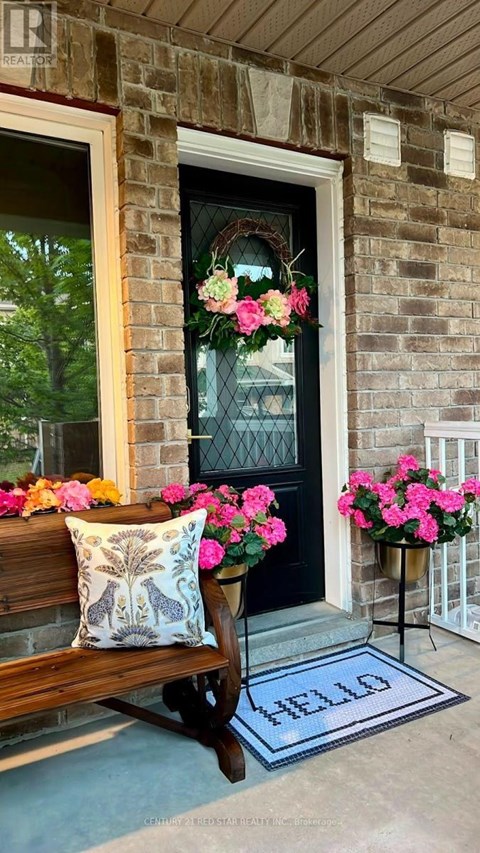 A house entrance with a pillow and a mat on the floor.