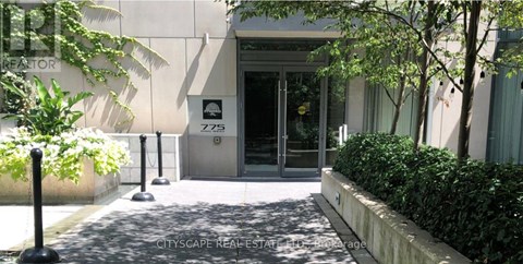 The image shows a building entrance with a glass door and a sign that reads "ZZ5".