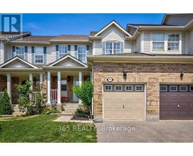 A house with a garage and a front porch is for sale.