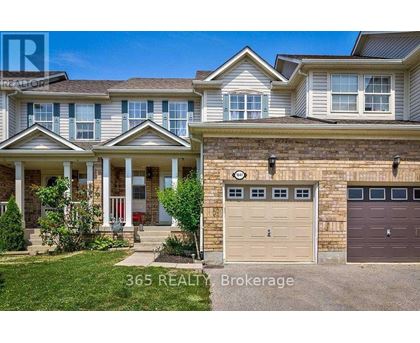 A house with a garage and a front porch is for sale.