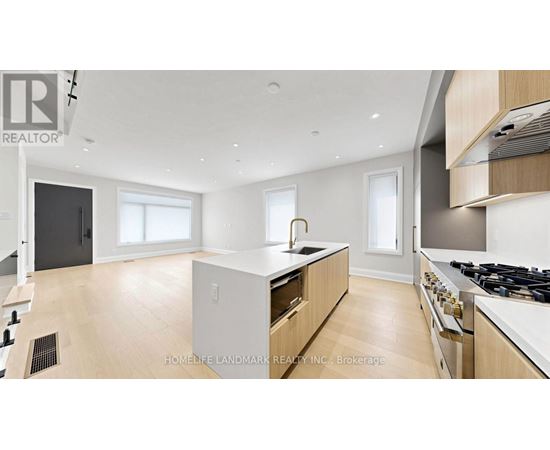 A modern kitchen with wooden cabinets and a central island.