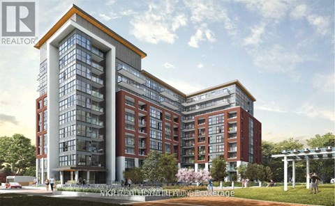 A modern multi-story building with a glass facade and a red brick exterior.