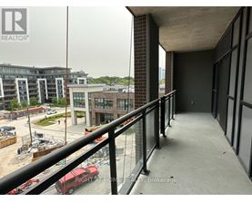 A balcony with a railing overlooks a construction site.