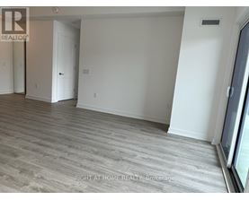 A room with a grey floor and white walls.