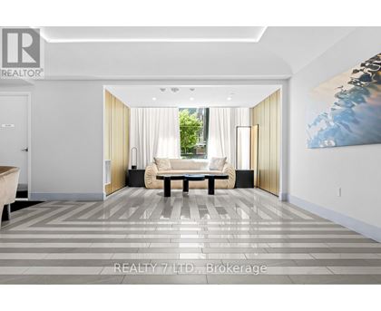 A modern living room with a large painting on the wall.