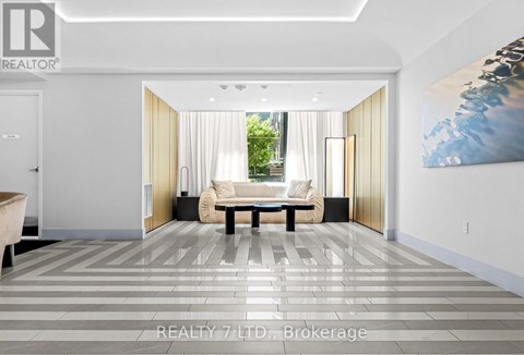 A modern living room with a large painting on the wall.