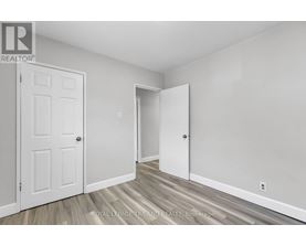 A white door is on the left and an open white door is on the right.