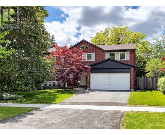 A house with a red brick exterior and a white garage door.