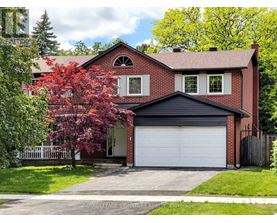 A red brick house with a white garage door.