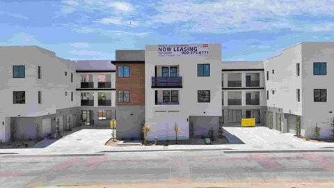 A building with a sign that says "Now Leasing" is shown.