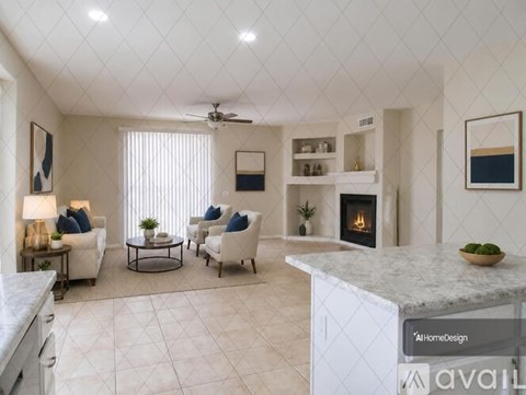 A spacious living room with a fireplace and a dining table set up.