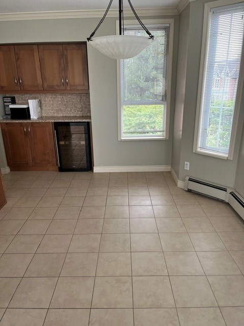 A kitchen with a microwave and toaster on the counter.