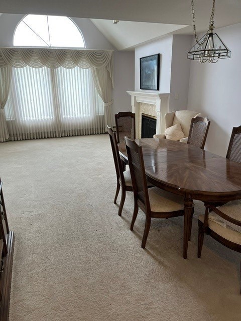 A dining room with a table and chairs.