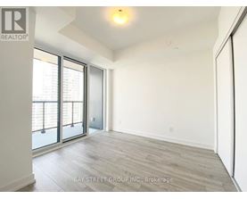 A spacious room with a view of the city through the windows.