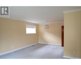 Empty room with a window and a door.