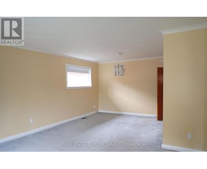 Empty room with a window and a door.