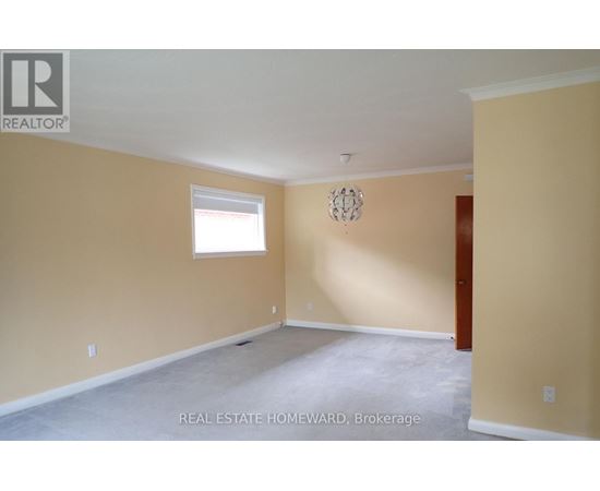 Empty room with a window and a door.
