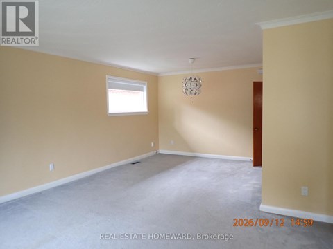 Empty room with a window and a door.