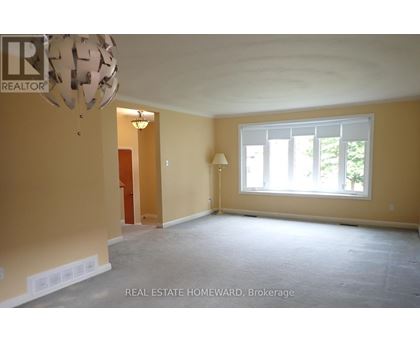 Empty room with a window and a lamp.