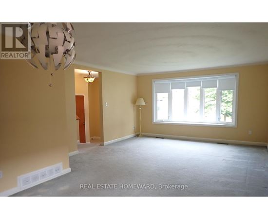 Empty room with a window and a lamp.